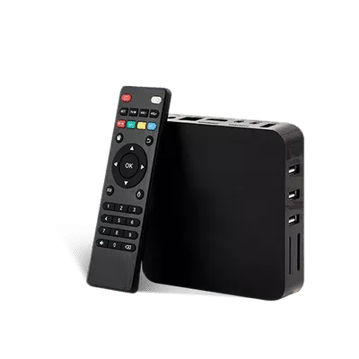 "Black TV box with remote control placed beside it."